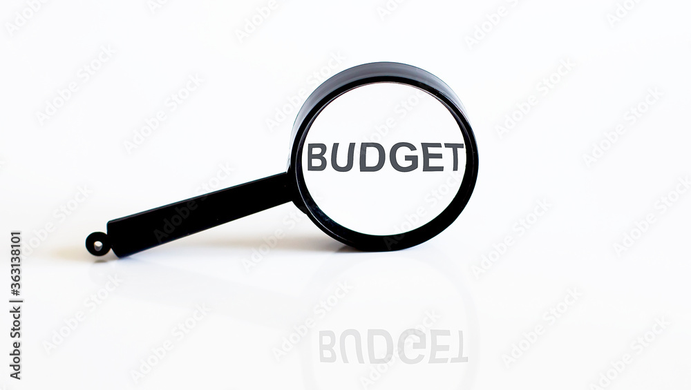 Magnifier with text BUDGET on the white background Magnifier with text BUDGET on the white background