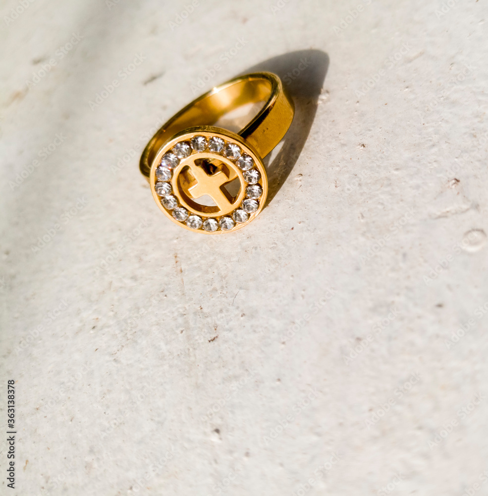 A golden ring placed on a white background. A golden ring placed on a white background.