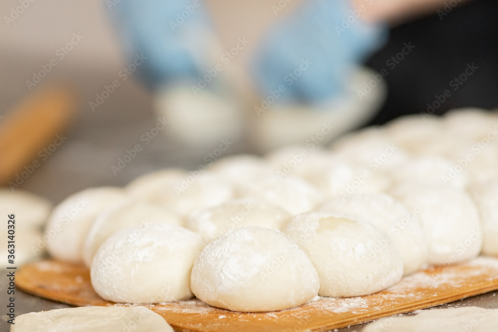 Fresh hot baked breads on automated production line bakery. Manufacture industrial Fresh hot baked breads on automated production line bakery. Manufacture industrial