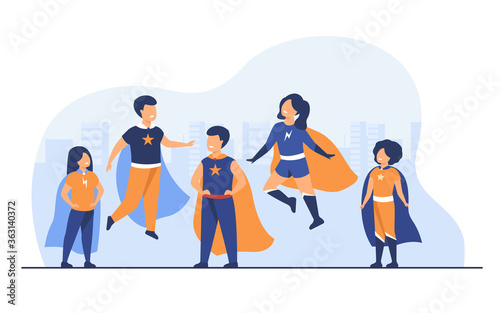 Children playing superhero characters. Cheerful kids wearing super hero costumes with cape, standing, jumping and flying with city scape in background. For comic book, entertainment, game concept