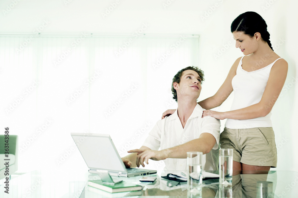 Man sharing some interesting information with his girlfriend Man sharing some interesting information with his girlfriend