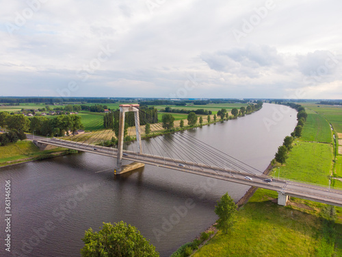 aerial view of the polder landscape with a river and a bridge