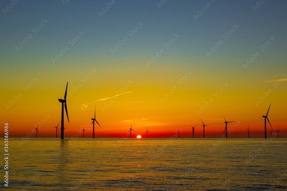 Beautiful sunset at the North Sea offshore wind farm Stock Photo ...