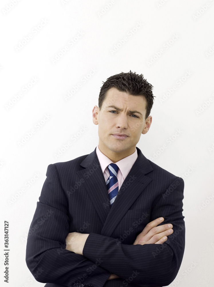Businessman with hands across chest Businessman with hands across chest