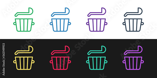 Set line Sauna bucket and ladle icon isolated on black and white background. Vector.