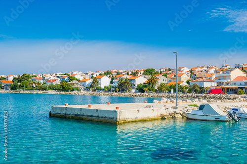 Croatia, town of Novalja on the island of Pag, boats in marina and turquoise sea in foreground © ilijaa