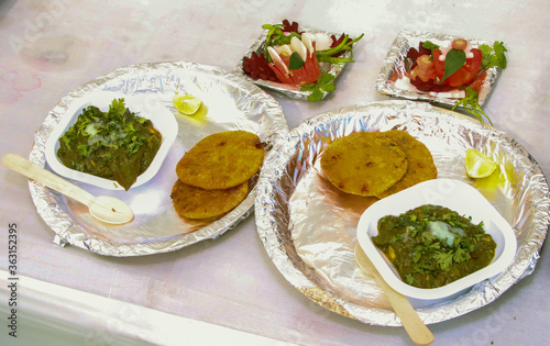 Traditional Indian lunch served in hygenic use and throw utensils