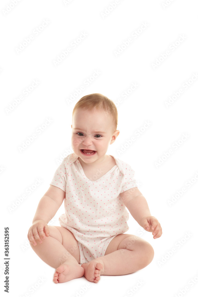 Sad baby girl sitting and crying isolated on white background Sad baby girl sitting and crying isolated on white background