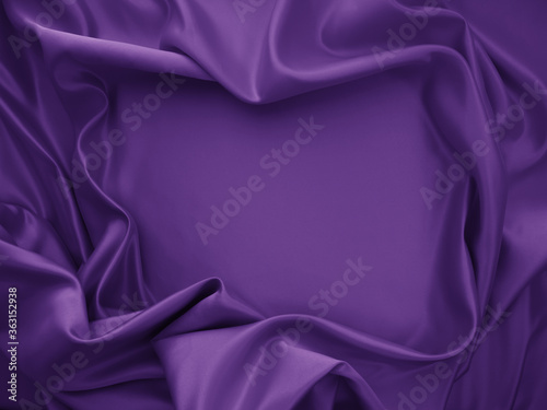 Beautiful elegant wavy violet purple satin silk luxury cloth fabric texture, abstract background design. Card or banner.

