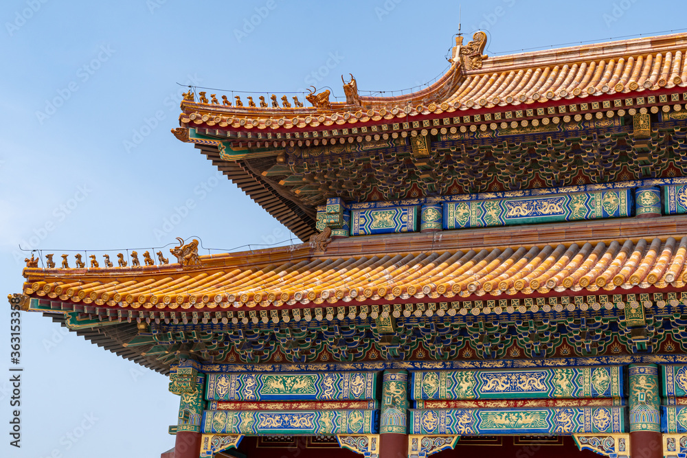 Forbidden City close to Tiananmen Square - the large square near the center of Beijing, Gate of Heavenly Peace . Eaves of traditional oriental ancient buildings.