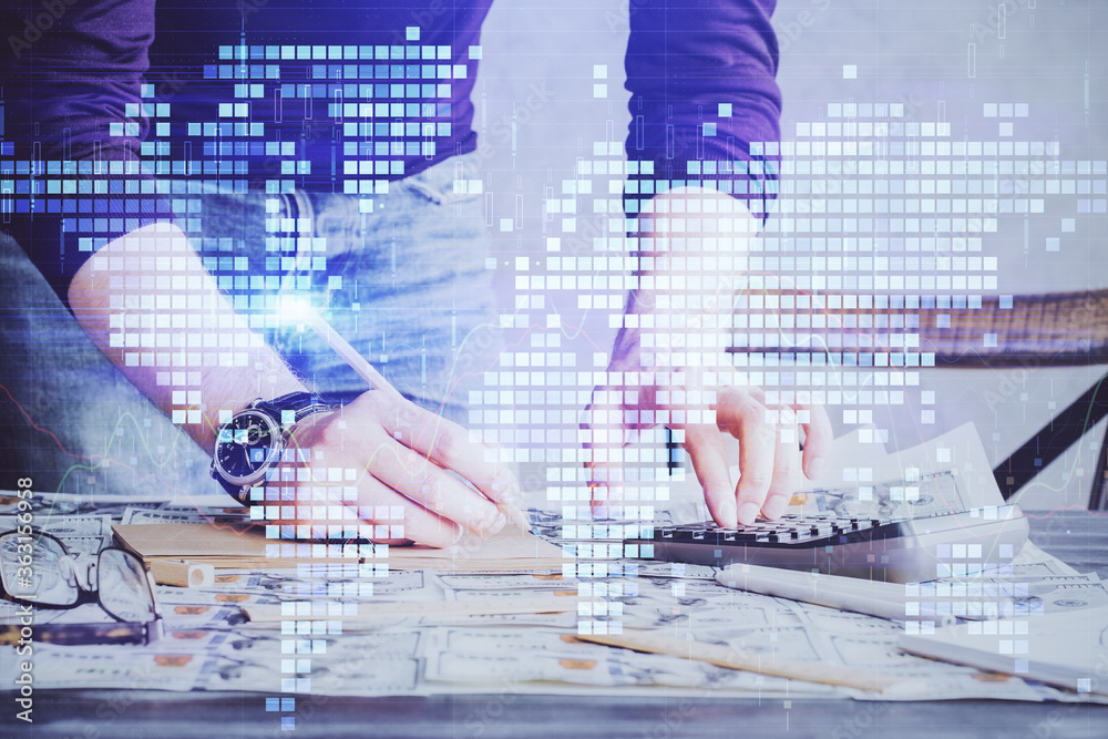 Double exposure of Man writing in notepad with business icons on background. Double exposure of Man writing in notepad with business icons on background.