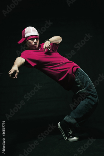 Young man making a breakdance move © ImageHit