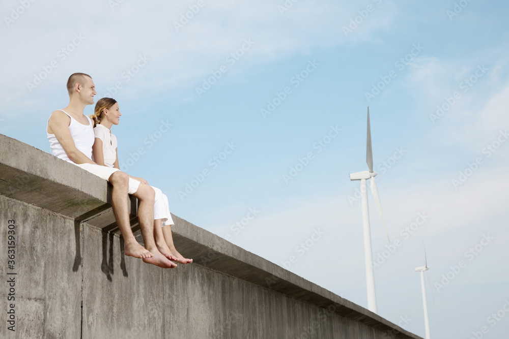Man and woman sitting together outdoors