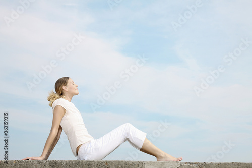 Woman closing her eyes, relaxing