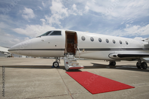 Private airplane with red carpet