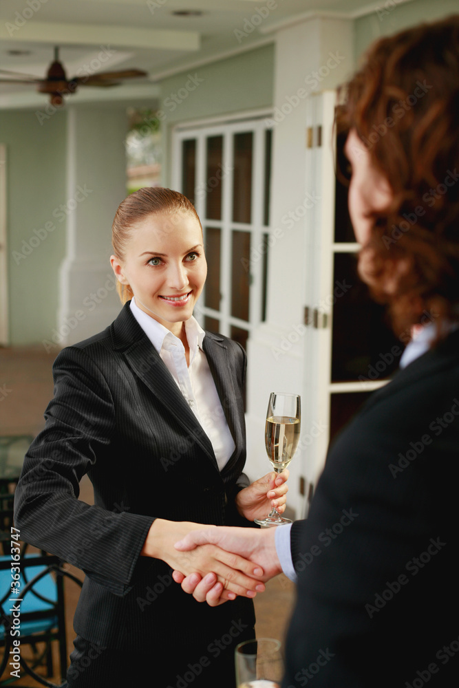 Businessman and businesswoman shaking hands Businessman and businesswoman shaking hands
