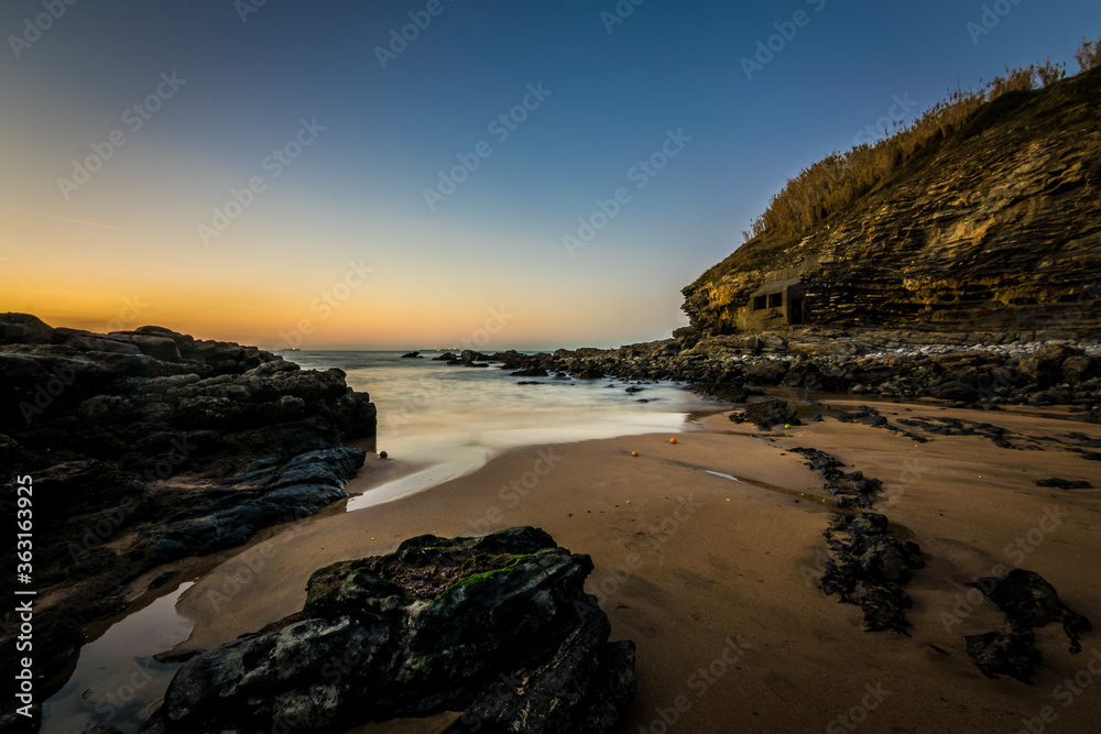 Sunset in a rocky beach