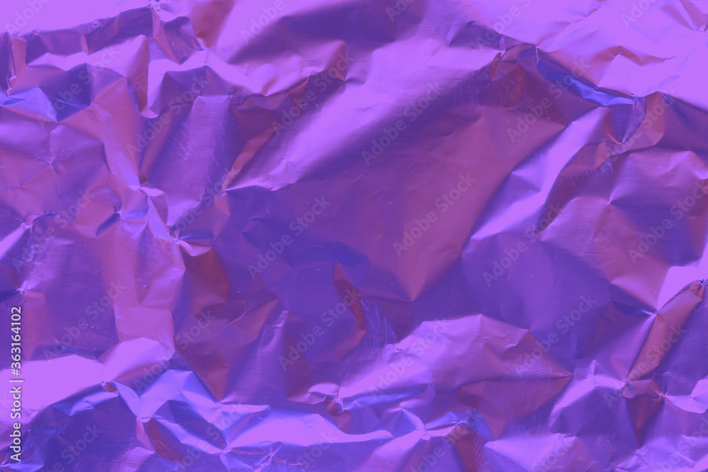 Obraz premium Crumpled purple foil. Purple foil background. Foil texture