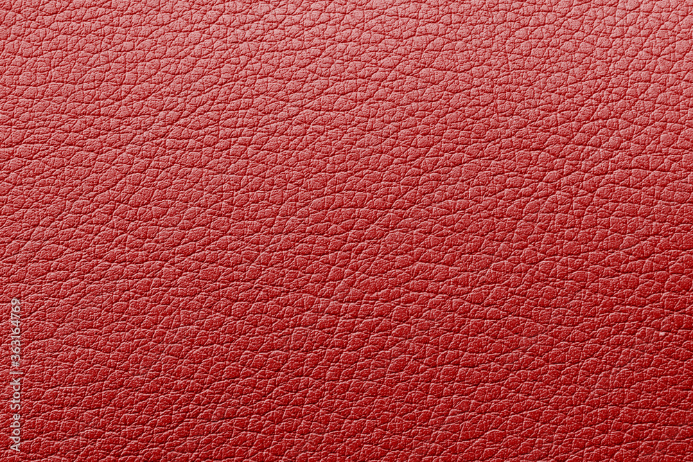 Fototapeta premium Red textured leather background. Abstract leather texture. Red natural leather texture, close up shot