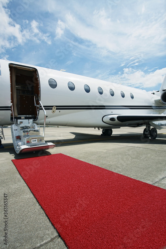 Private airplane with red carpet