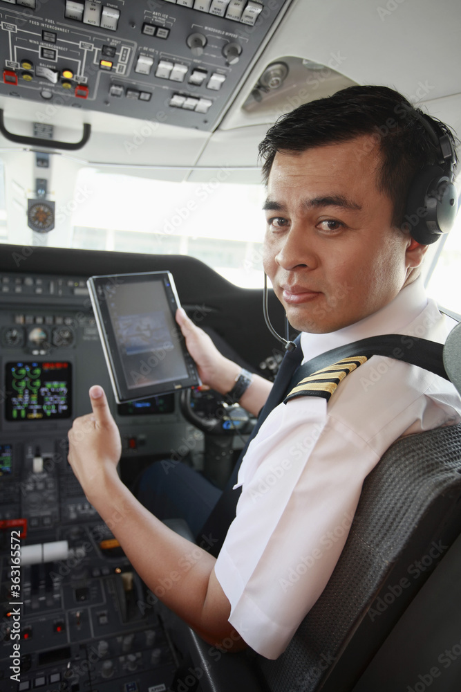 Pilot in private jet cockpit