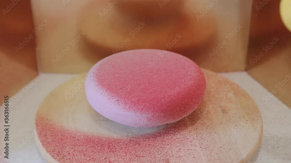 Cooking cake with velour coating. the confectioner spraying velour coating on the mousse cake Cooking cake with velour coating. the confectioner spraying velour coating on the mousse cake