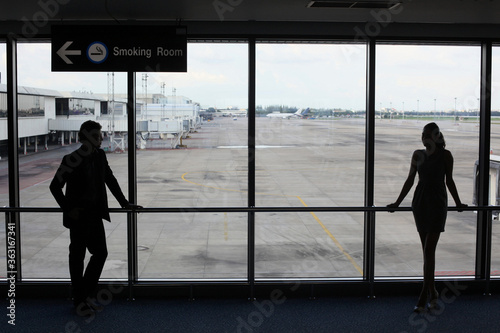 Businessman waiting for his flight in airport lounge