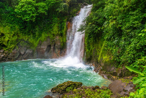 Waterfall and natural pool with turquoise  blue water of Rio Celeste in Tenorio Volcano national park  Costa Rica. Central America.