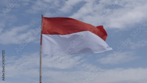 Indonesia Flag Fluttering in Sky. Indonesia Independence Day in August.