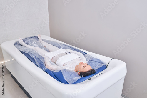 Photography Modern floating machine and young woman relaxing on it