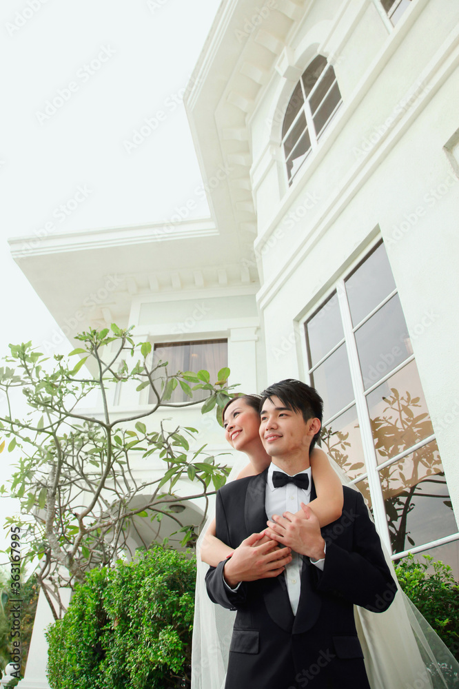 Bride and groom embracing Bride and groom embracing