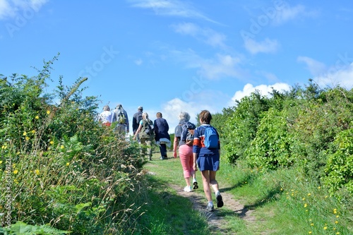 Senior hikers on the path along the sea in Brittany France © aquaphoto