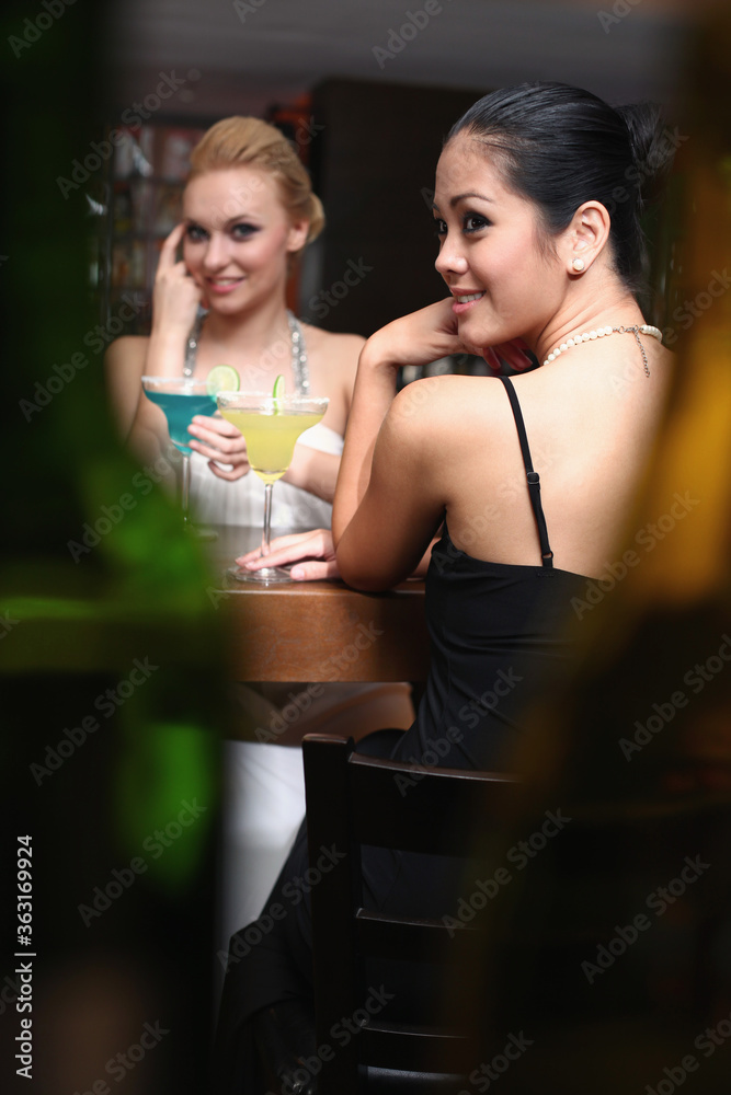 Women drinking at a bar
