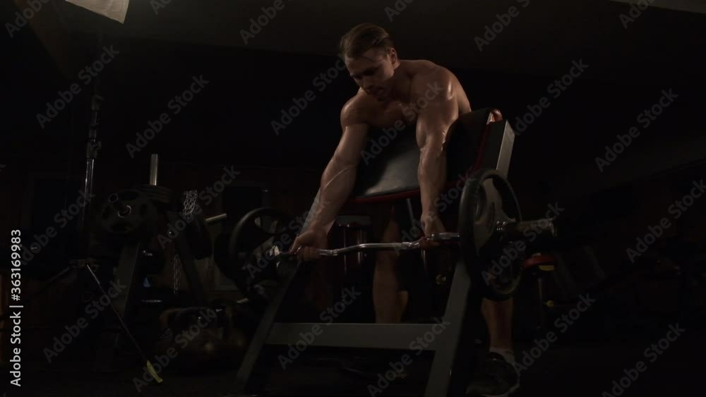 guy in the gym training biceps guy in the gym training biceps