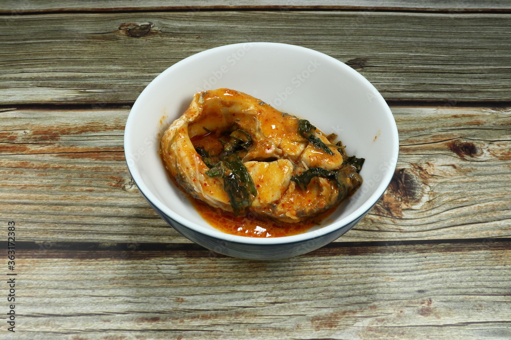 Steamed cutting snapper fish fillet with Thai red curry and coconut