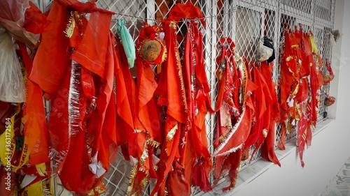 Hindu religious holy flags tied in temple on a hill photo