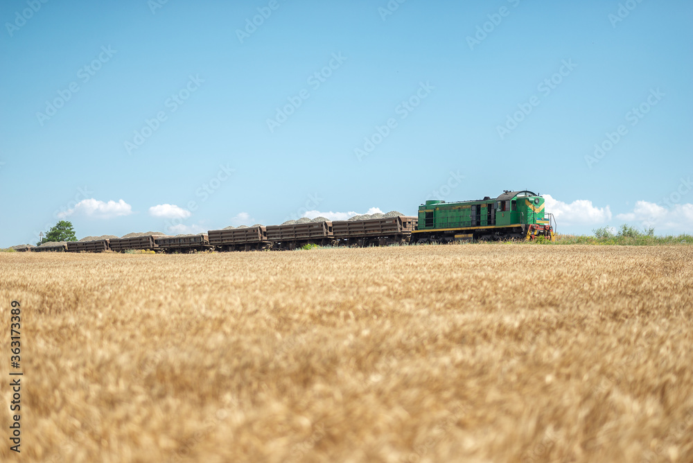 A train passes a wheat field A train passes a wheat field
