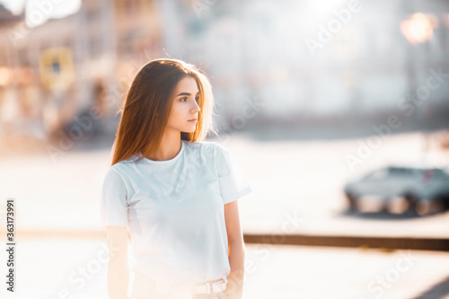 Beautiful tourist girl on city street. Gorgeous young model