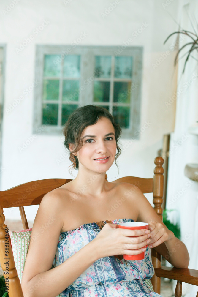 Woman with a cup of tea Woman with a cup of tea