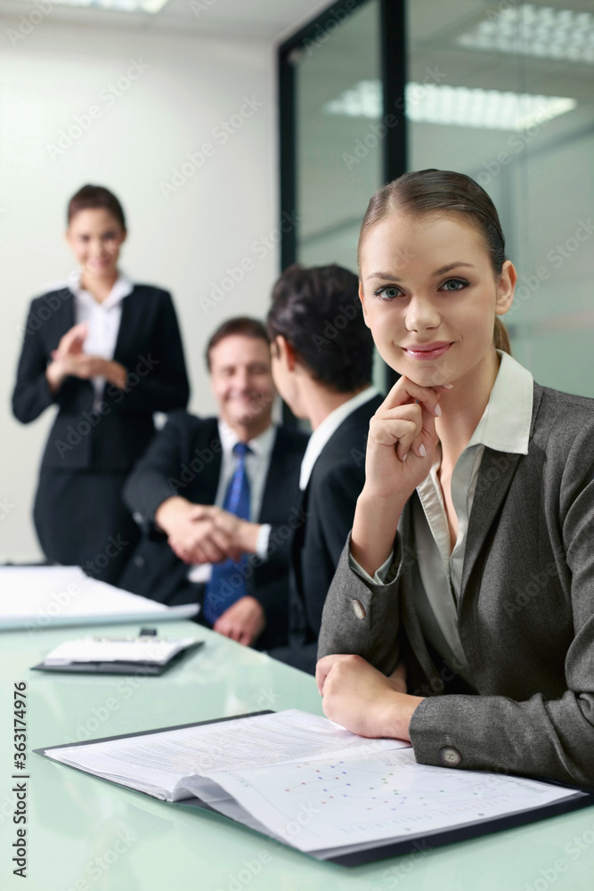 Businesswoman sitting at the conference table Businesswoman sitting at the conference table