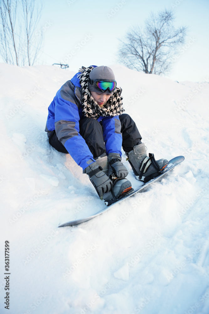 Man getting ready for snowboarding Man getting ready for snowboarding