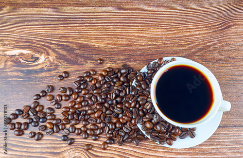 Coffee beans on the woonden table. photo