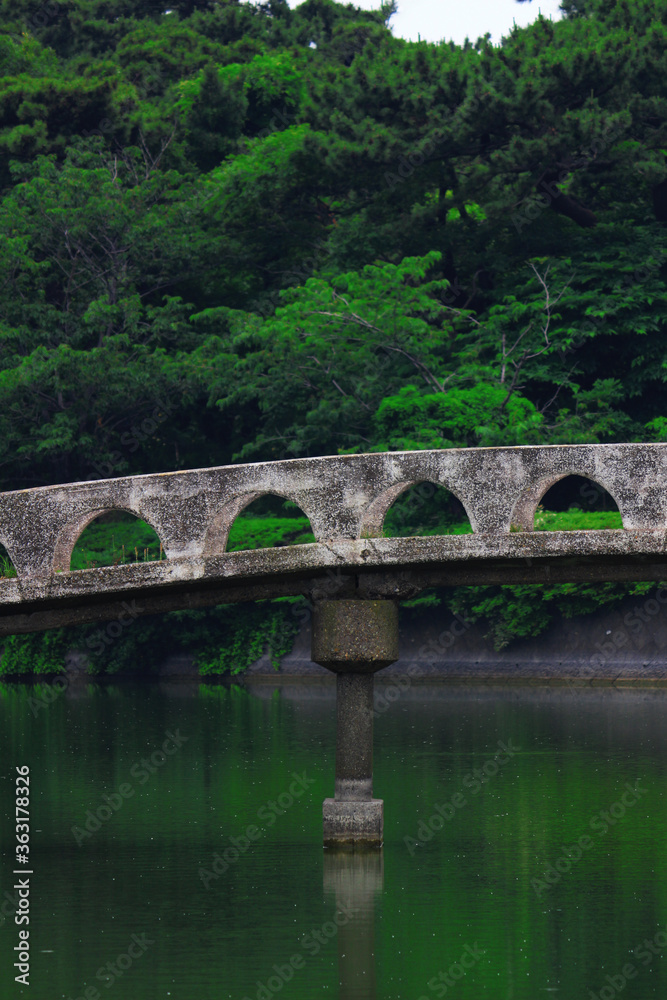 Concrete bridge over the pond in Futtsu Park in Chiba