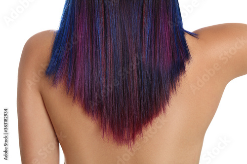 Young woman with bright dyed hair on white background, back view. Closeup