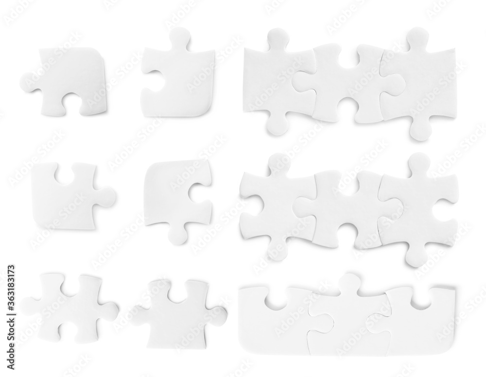 Set with jigsaw puzzle pieces on white background, top view Set with jigsaw puzzle pieces on white background, top view
