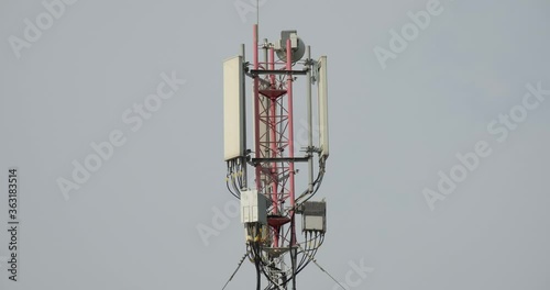 Close-up shot of Telecommunication tower. Telecom tower antennas and satellite transmits the signals of cellular 5g 4g mobile signals to the consumers and smartphones. 4k. 23.98 fps