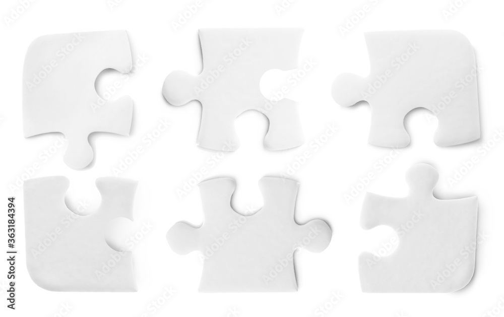 Set with jigsaw puzzle pieces on white background, top view Set with jigsaw puzzle pieces on white background, top view
