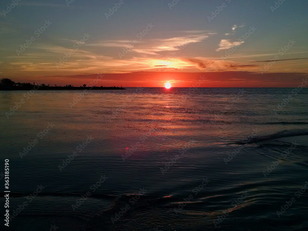 light red sunset beautiful view panorama home blue sea with red cloud sky of tropical beach