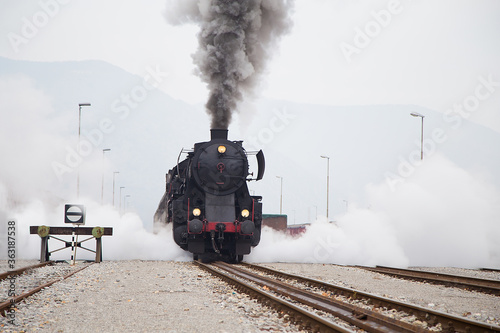 Old Steam train - locomotive is leaving the Railway Station at Nova Gorica, Slovenia