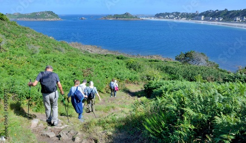 Senior hikers on the path along the sea in Brittany France
